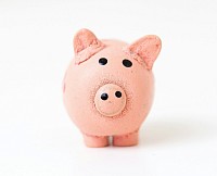 Tirelire cochon triste